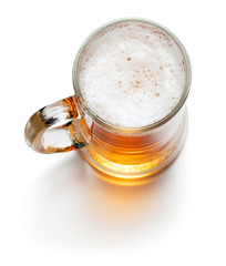 top view of mug of beer isolated on white background