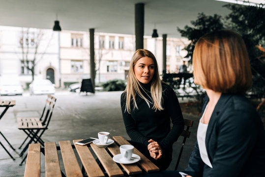 Two Businesswoman Having A Coffee Break.