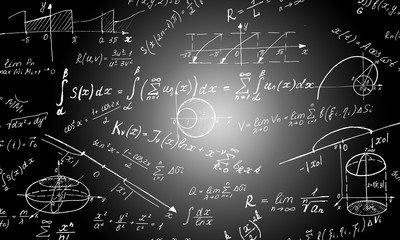 Maths formulas written by white chalk on the blackboard background