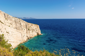 Fototapeta na wymiar View of beautiful cliff and blue sea near Skinari cape on Zakynthos island. Greece.