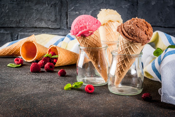 Summer sweet berries and desserts, various of ice cream flavor in cones pink (raspberry), vanilla...