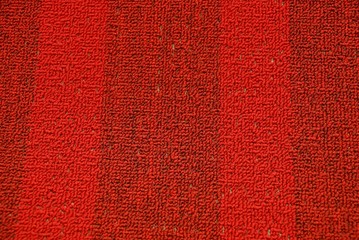 red woolen texture from a piece of carpet