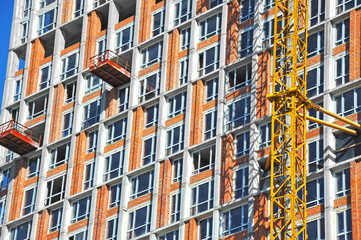 Obraz premium Crane and highrise construction site