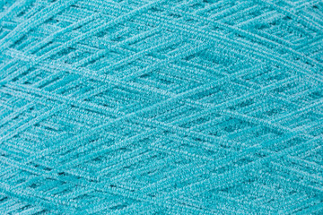 background of chenille yarn in turquois - selective focus