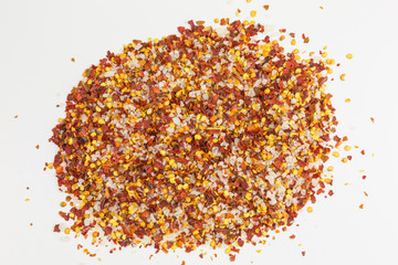 heap of sea salt mixed with dried chili flakes and seeds