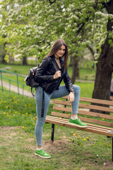 Glamorous young caucasian woman in black leather jacket