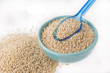 Quinoa grains in bowl isolated on white background, Chenopodium quinoa