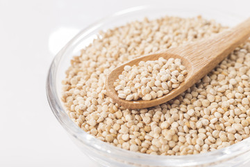 Quinoa grains in bowl isolated on white background, Chenopodium quinoa