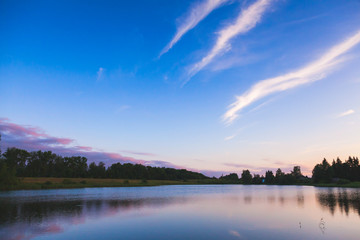 Dramatic landscape with still lake water