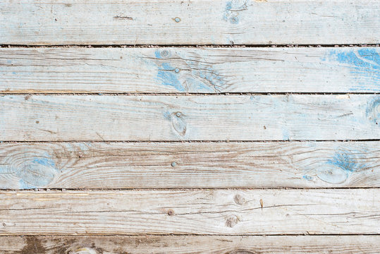 Wooden rustic retro background - gray old boards with the remains of blue paint