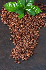 Roasted coffee beans on  concrete background