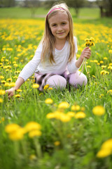 portrait of little girl outdoors in summer