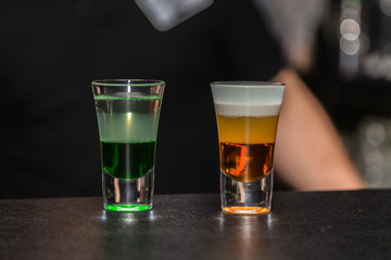 Colored cocktail on the bar in the nightclub