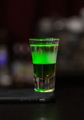 Colored cocktail on the bar in the nightclub