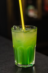 Colored cocktail on the bar in the nightclub