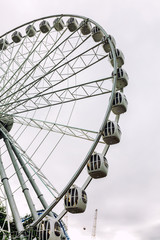 Fototapeta na wymiar Ferris wheel in the park, close-up