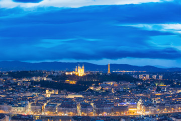 Aerial view of Old town with Fourviere cathedral during evening blue hour in Lyon, France