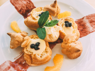 profiteroles with cream and orange cream