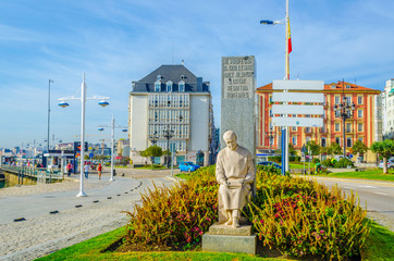 People are strolling on promenade in Santander, Spain