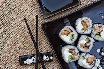 Sushi rolls  on black  table 