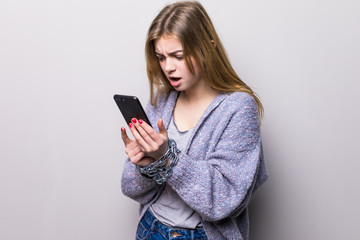 Fototapeta premium Teen Girl with chain locked hands using a smartphone isolated on white background