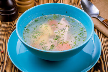 Fish soup on white plate
