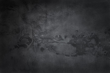Black concrete wall background. Abstract dark texture for design.
