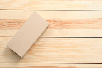 Cardboard box on wooden background