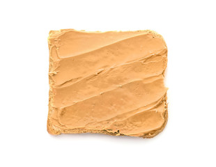 Tasty toast with peanut butter on white background