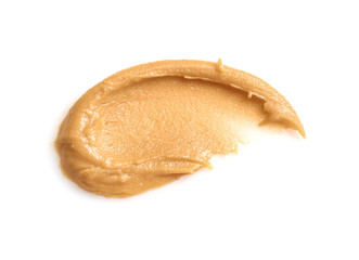 Creamy peanut butter on white background