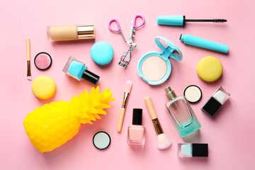 Naklejka premium Flat lay composition with decorative cosmetics on color background