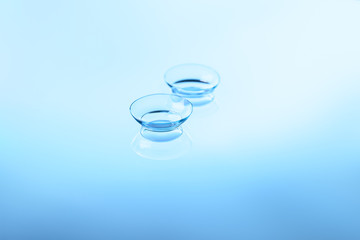 Contact lenses on color background