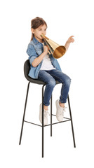 Adorable little girl with vintage megaphone on white background