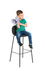 Adorable little boy with megaphone on white background