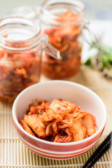 Kimchi cabbage (Korean food) in a bowl and jar