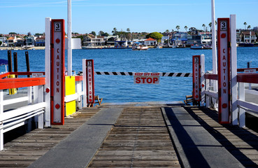 Fototapeta na wymiar Car ferry loading ramp with water in background