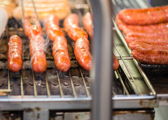 Sausages grilling on barbecue