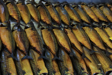 Smoked mackerel on market stall