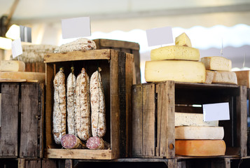 Variety of organic cheeses and home made sausages on farmer market in Strasbourg, France