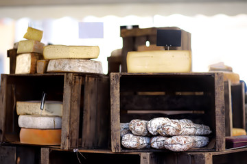 Variety of organic cheeses and home made sausages on farmer market in Strasbourg, France