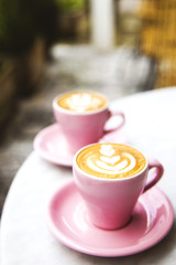 Cup of hot latte coffee on marble table background