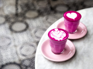 Cup of hot latte coffee on marble table background