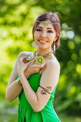 Beautiful young asian woman with kiwi