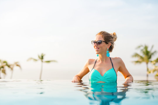 Woman in infinity pool