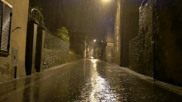 Biella, Italy - April 11, 2018 - Strong night rain in the main street of the country, Tavigliano 