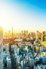 Naklejka premium Asia business concept for real estate and corporate construction - panoramic urban city skyline aerial view under twilight sky and golden sun in hamamatsucho, tokyo, Japan