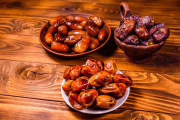 Date fruits on the rustic wooden table