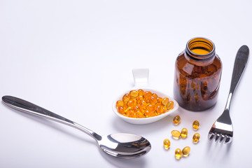 Fish oil and cod liver oil on the white background with copy space for text.