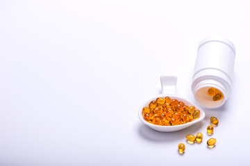 Fish oil and cod liver oil on the white background with copy space for text.