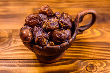 Date fruits on the rustic wooden table
